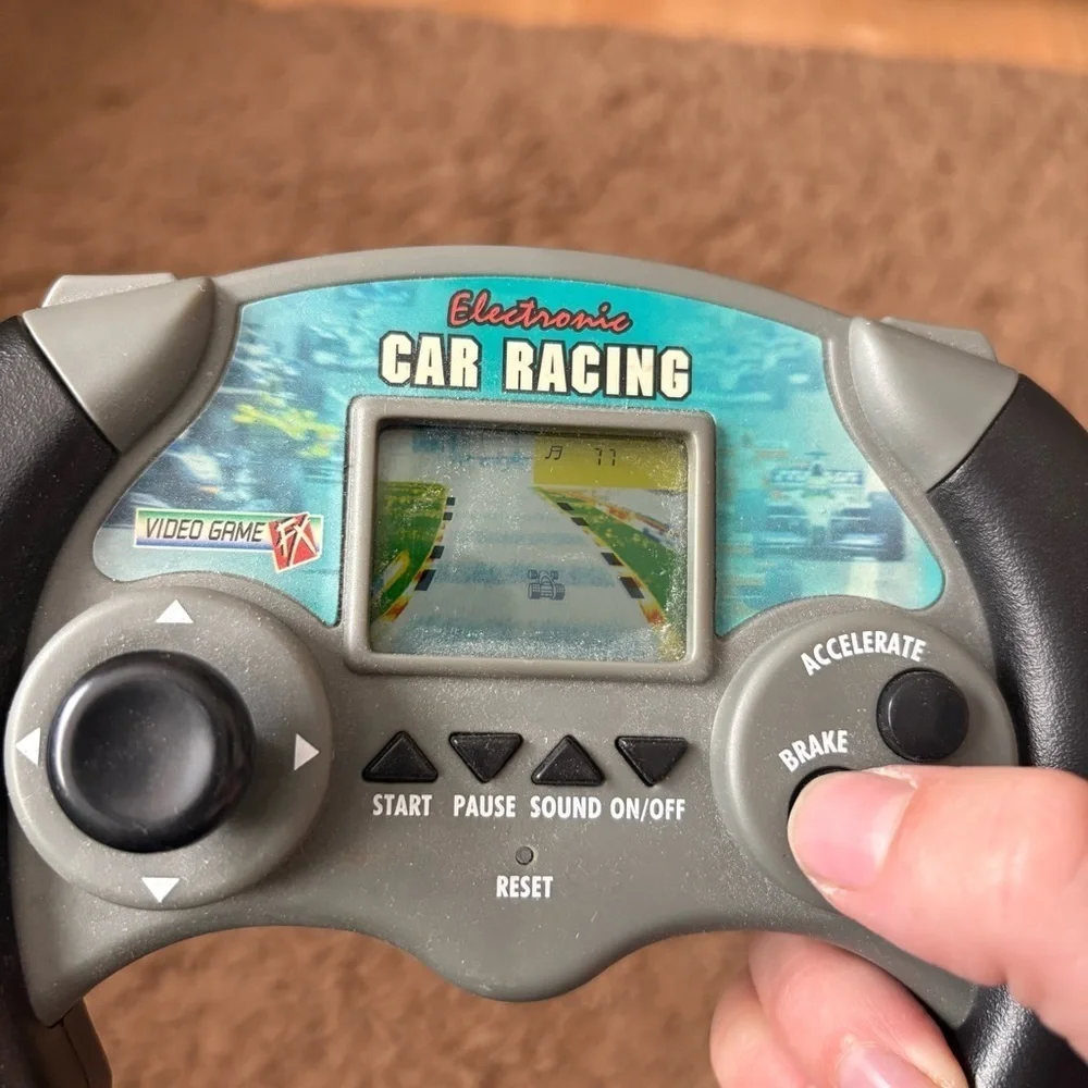 Toy Quest: Electronic Car Racing FX Handheld Video Game Tested and working
